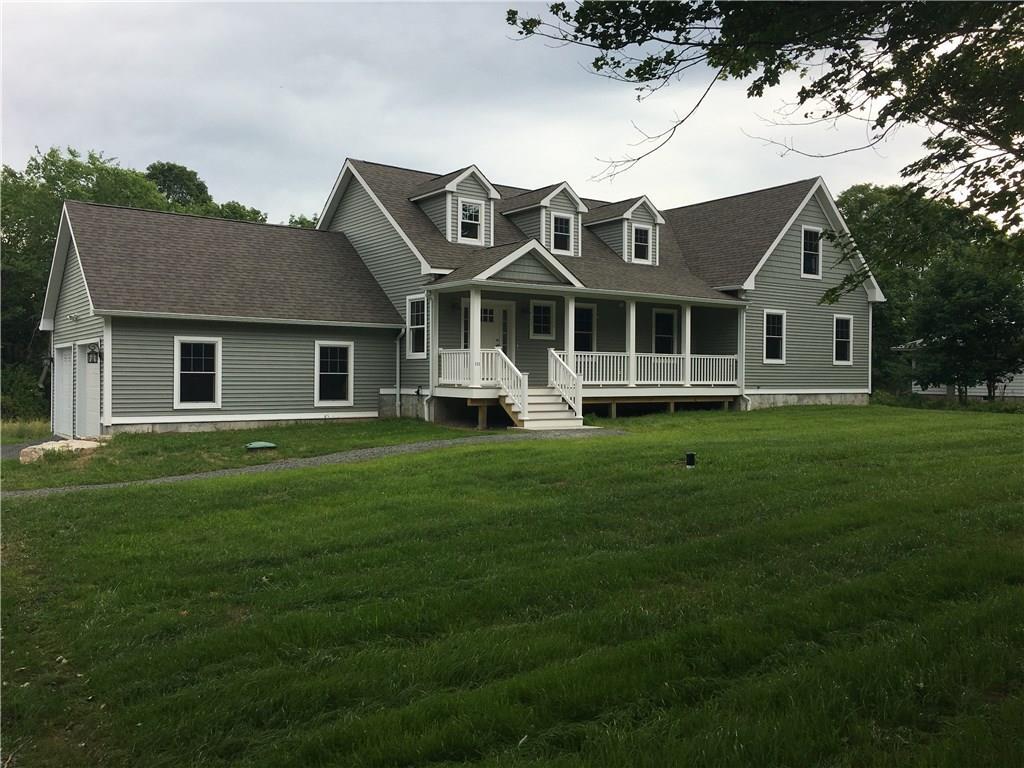 1 Little Meadow Road Guilford, CT 06437 - Photo 1 of 1 a front view of a house with a garden