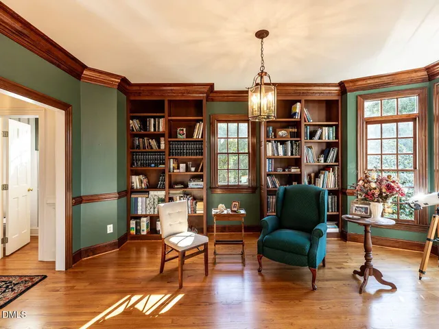 a bathroom with a tub sink vanity and granite