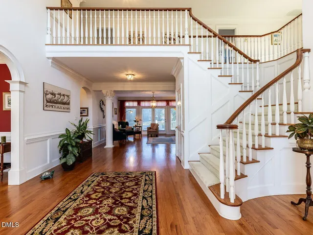 an aerial view of a house with a swimming pool