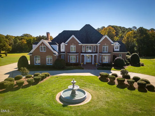 a living room with furniture a table and chairs