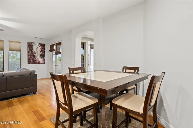 a view of a dining room with furniture and window