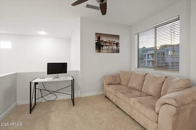 a living room with furniture and a window
