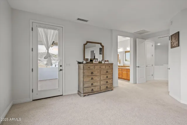 wooden floor with cabinet and mirror