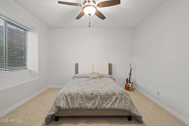 a room with a bed and window