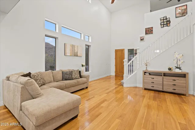 a living room with furniture and flat screen tv