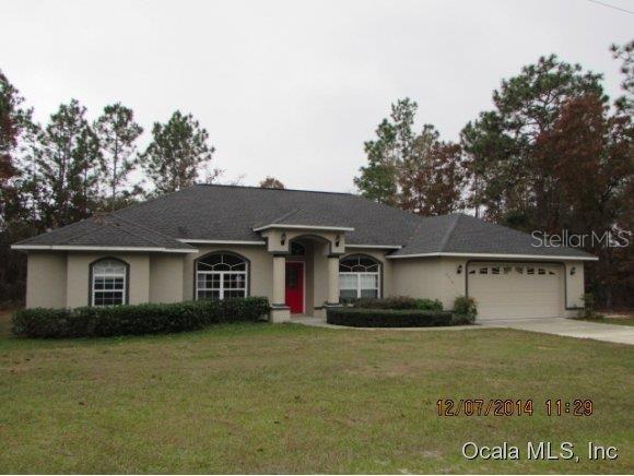 6210 Southwest 147th St Road Ocala, FL 34473 - Photo 1 of 1 a front view of a house with a yard