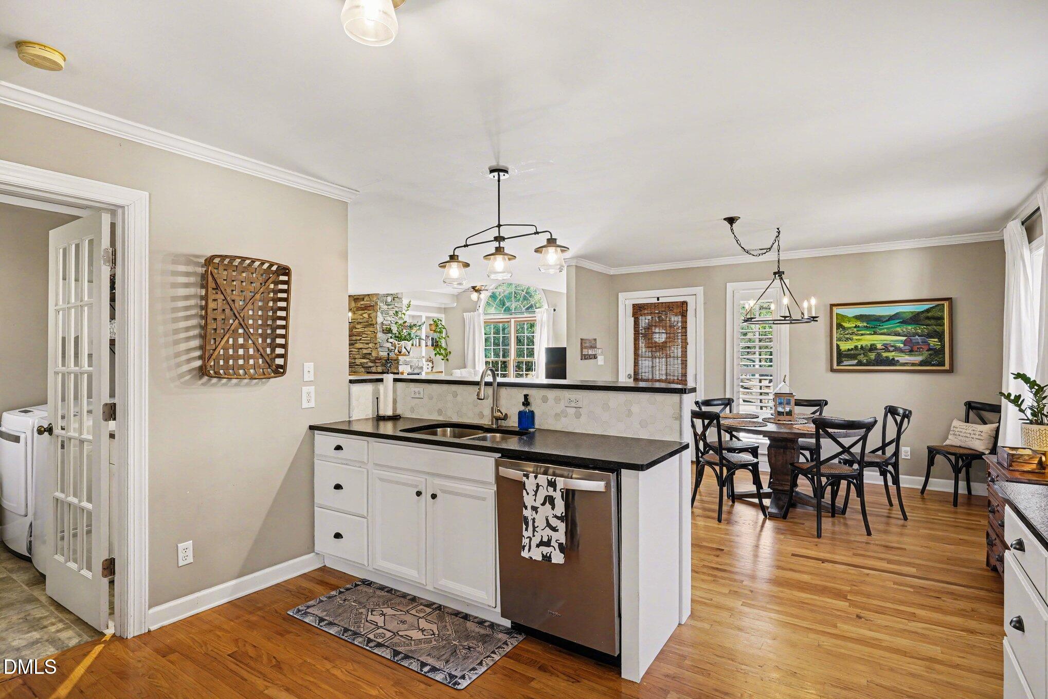 3400 Octavia Street Raleigh, NC 27606 - Photo 13 of 36 a view of a kitchen and dining room