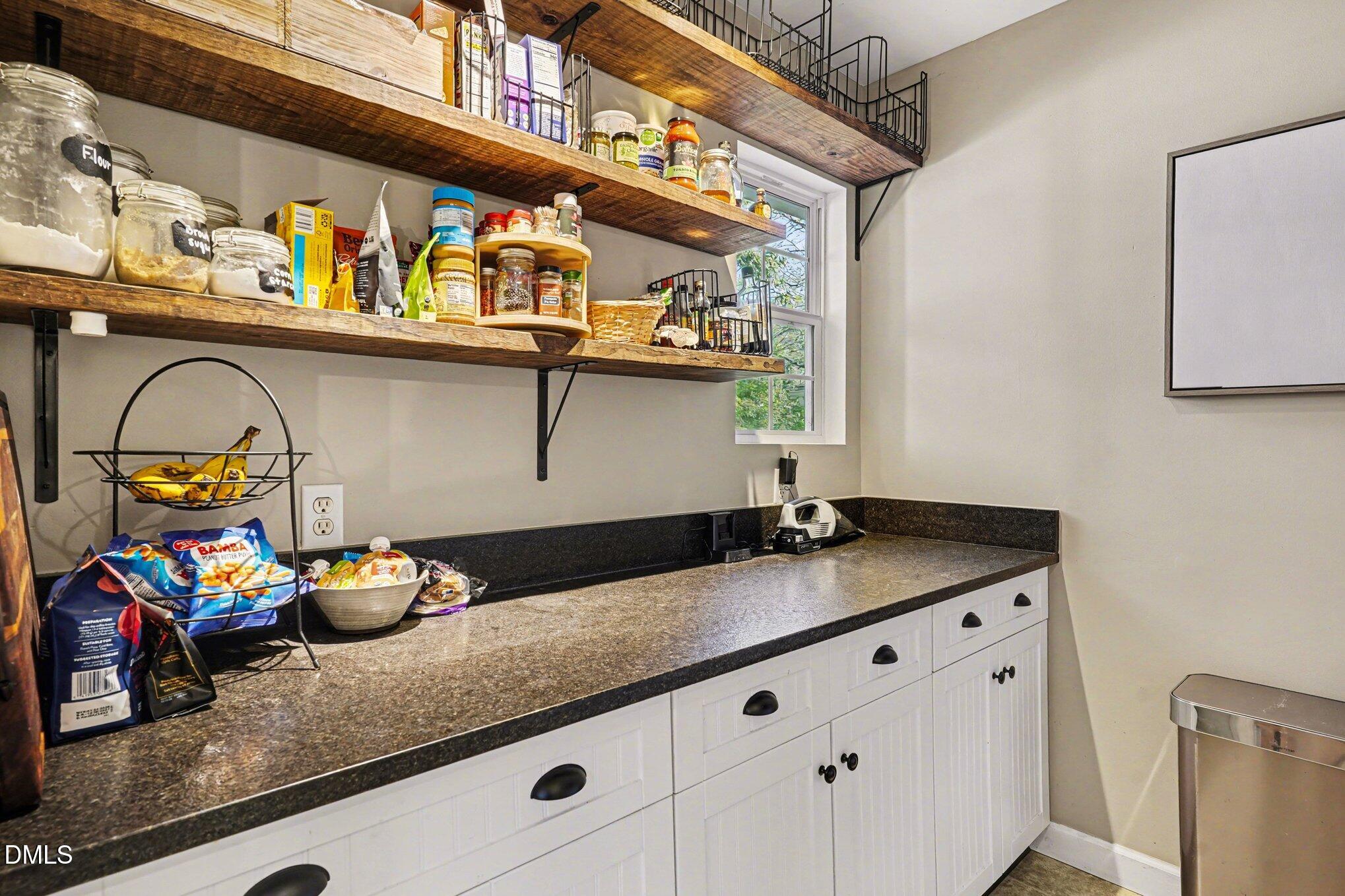 3400 Octavia Street Raleigh, NC 27606 - Photo 15 of 36 a bathroom with a sink and a mirror