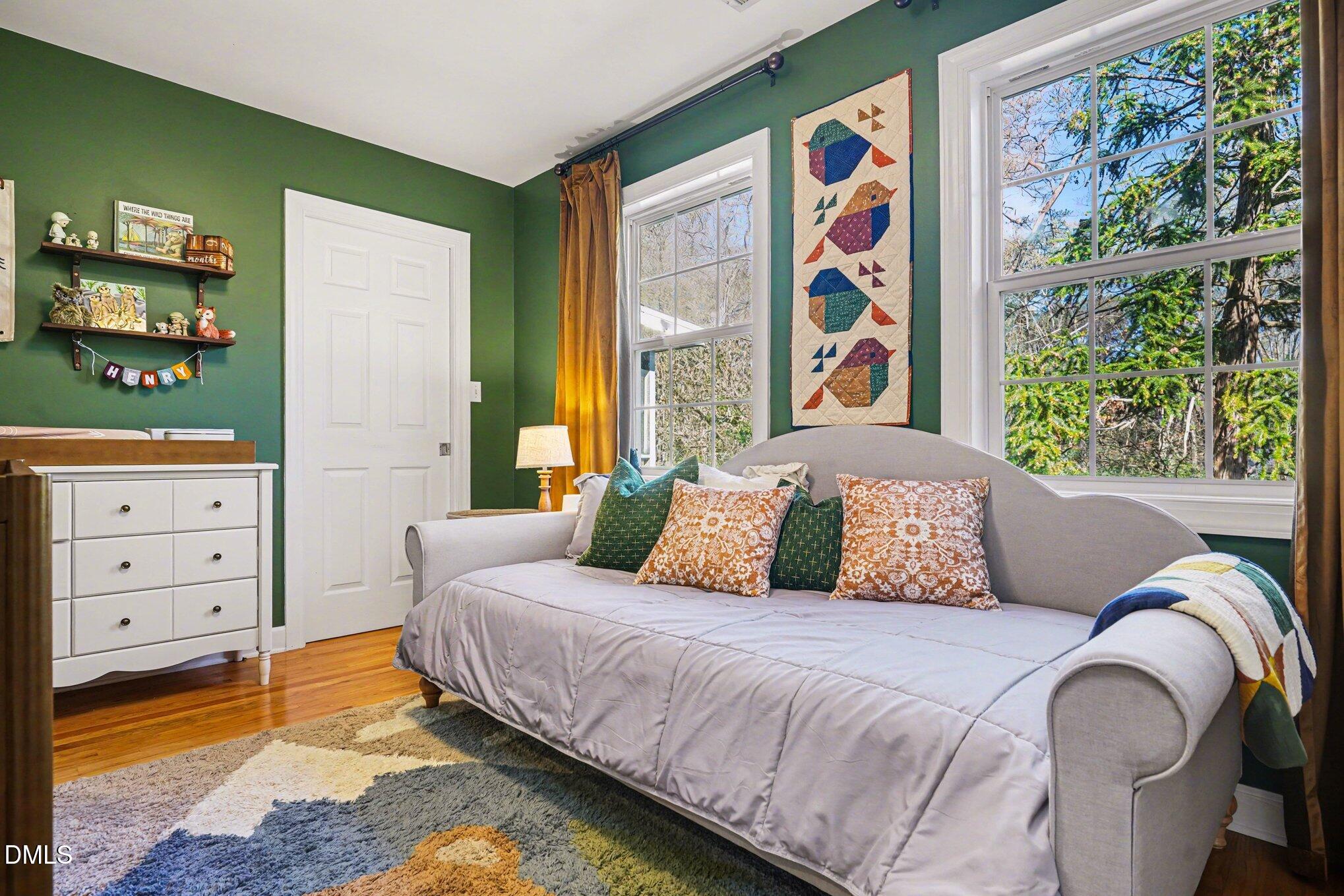 3400 Octavia Street Raleigh, NC 27606 - Photo 21 of 36 a bedroom with a bed and a window