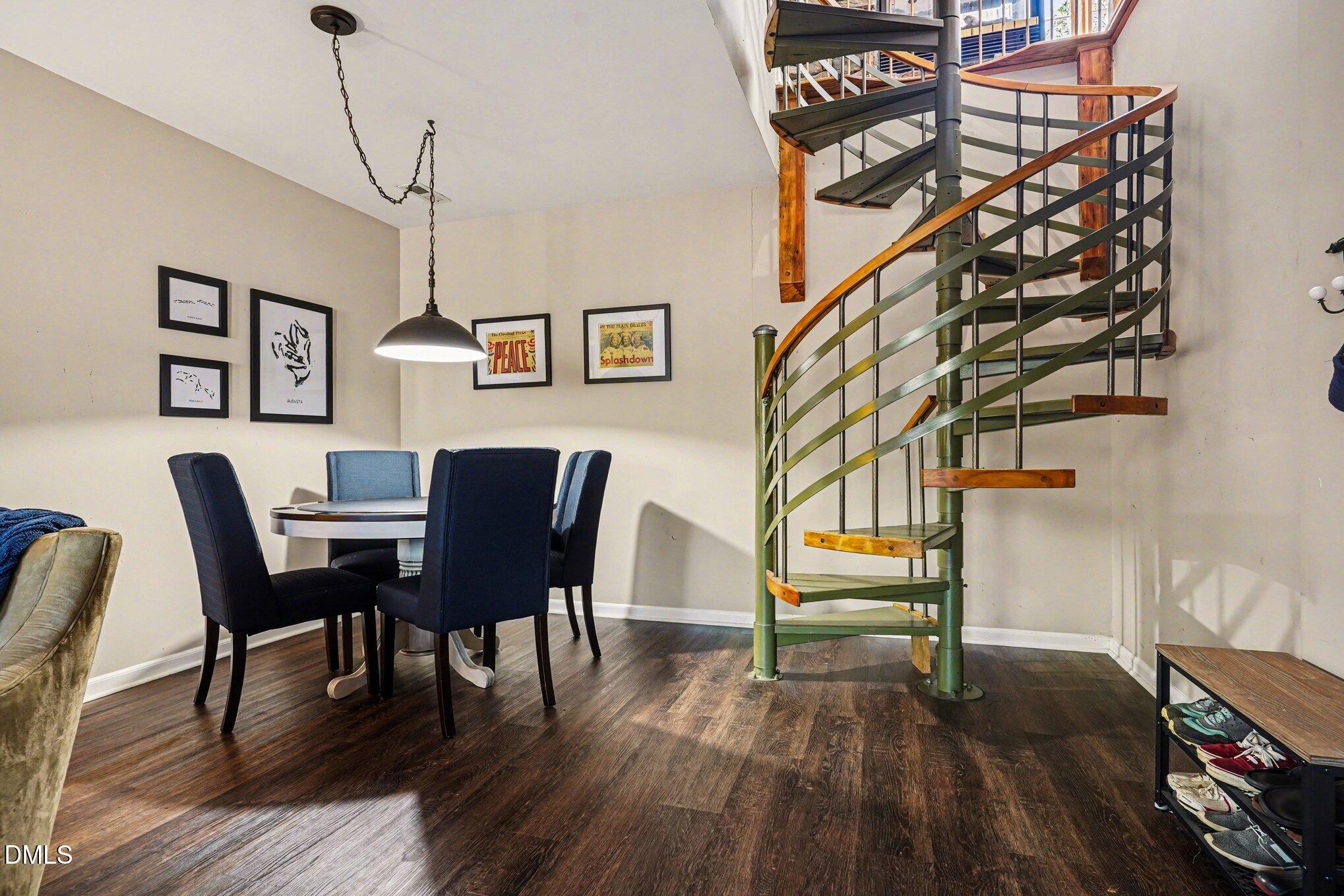 3400 Octavia Street Raleigh, NC 27606 - Photo 25 of 36 a view of a dining room with furniture and wooden floor