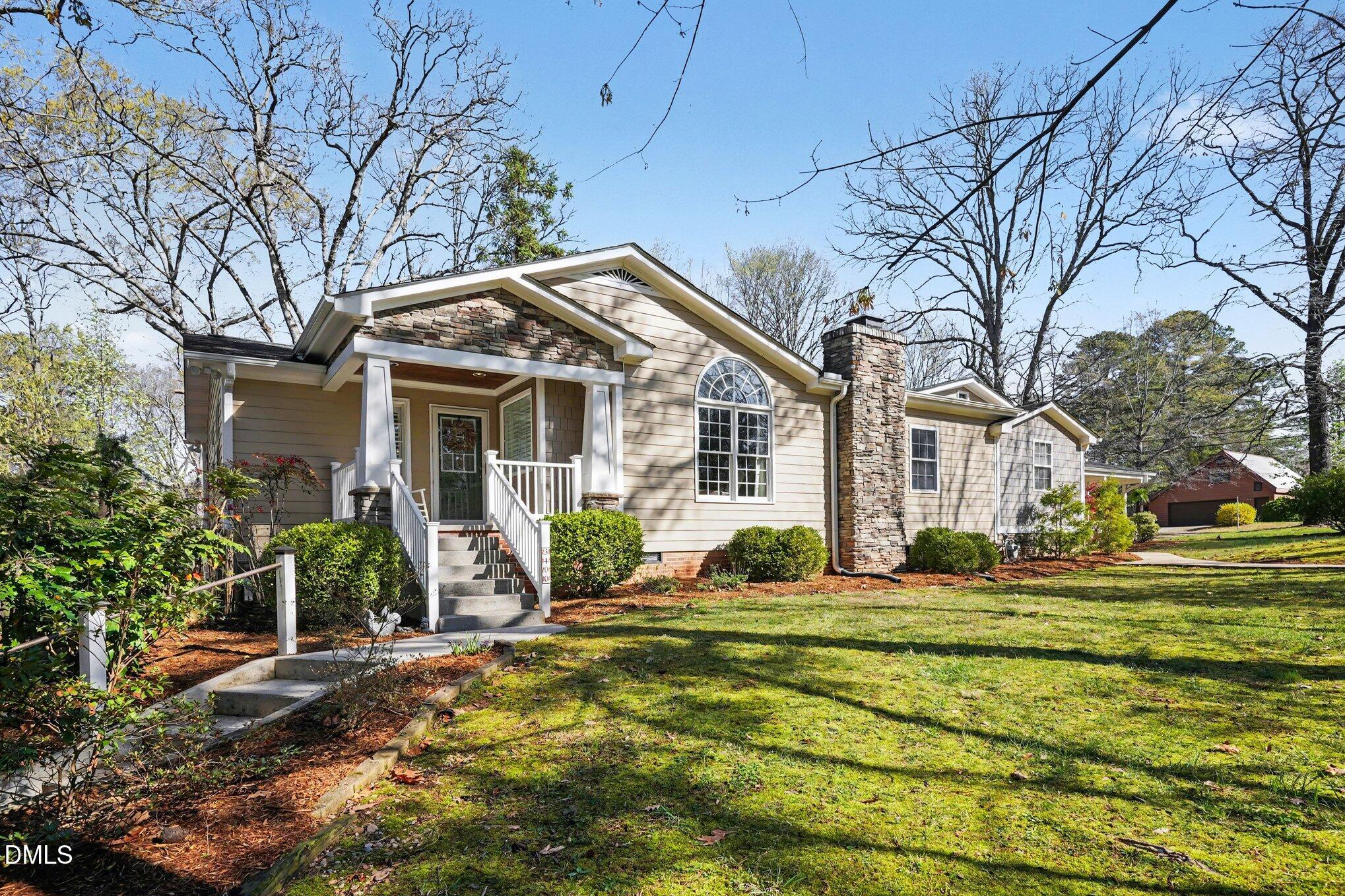 3400 Octavia Street Raleigh, NC 27606 - Photo 3 of 36 a front view of a house with a yard