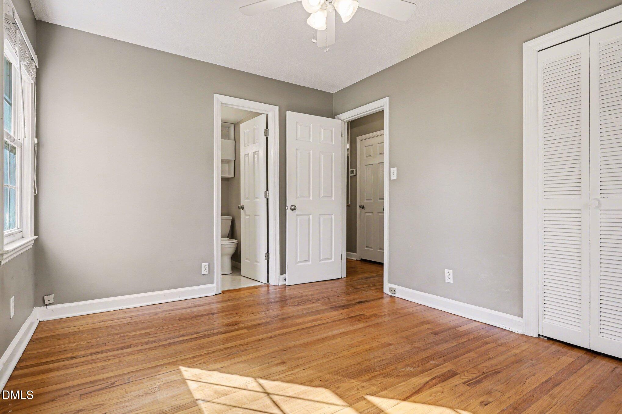 3400 Octavia Street Raleigh, NC 27606 - Photo 34 of 36 wooden floor in an empty room with a window