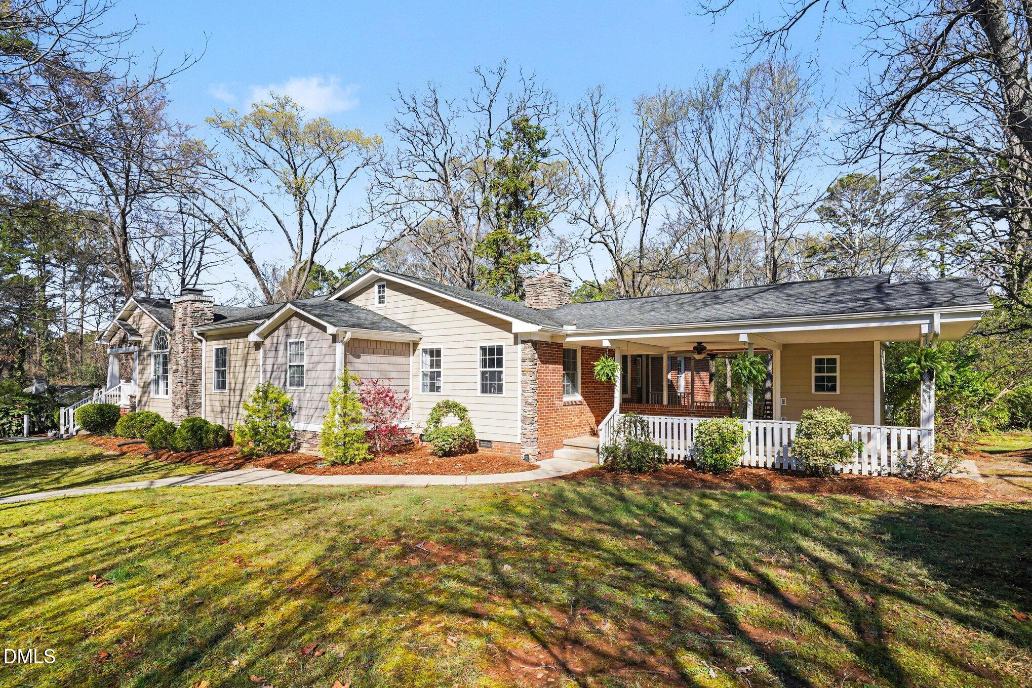 3400 Octavia Street Raleigh, NC 27606 - Photo 6 of 36 a front view of a house with a yard