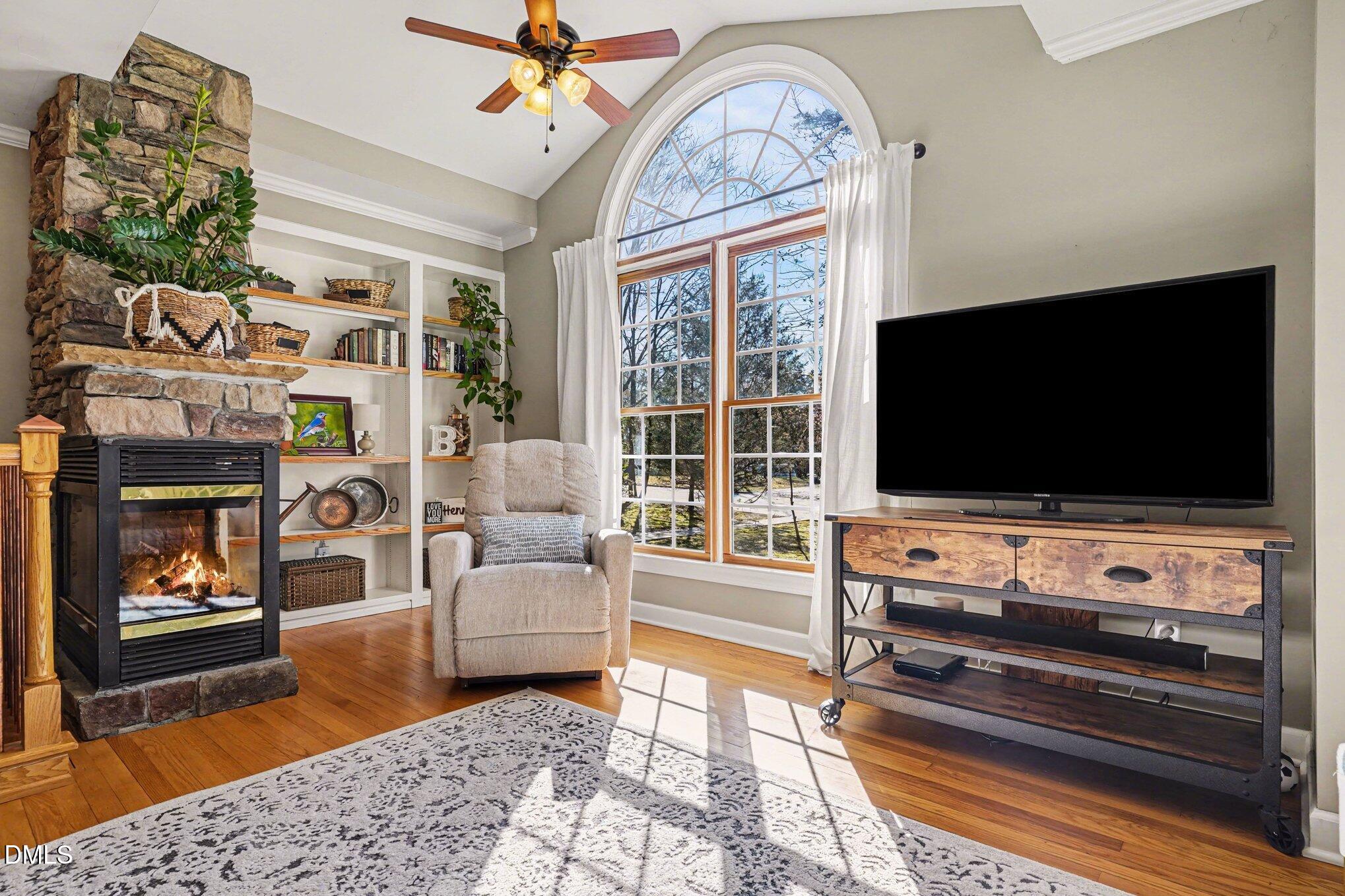 3400 Octavia Street Raleigh, NC 27606 - Photo 8 of 36 a living room with furniture and a flat screen tv