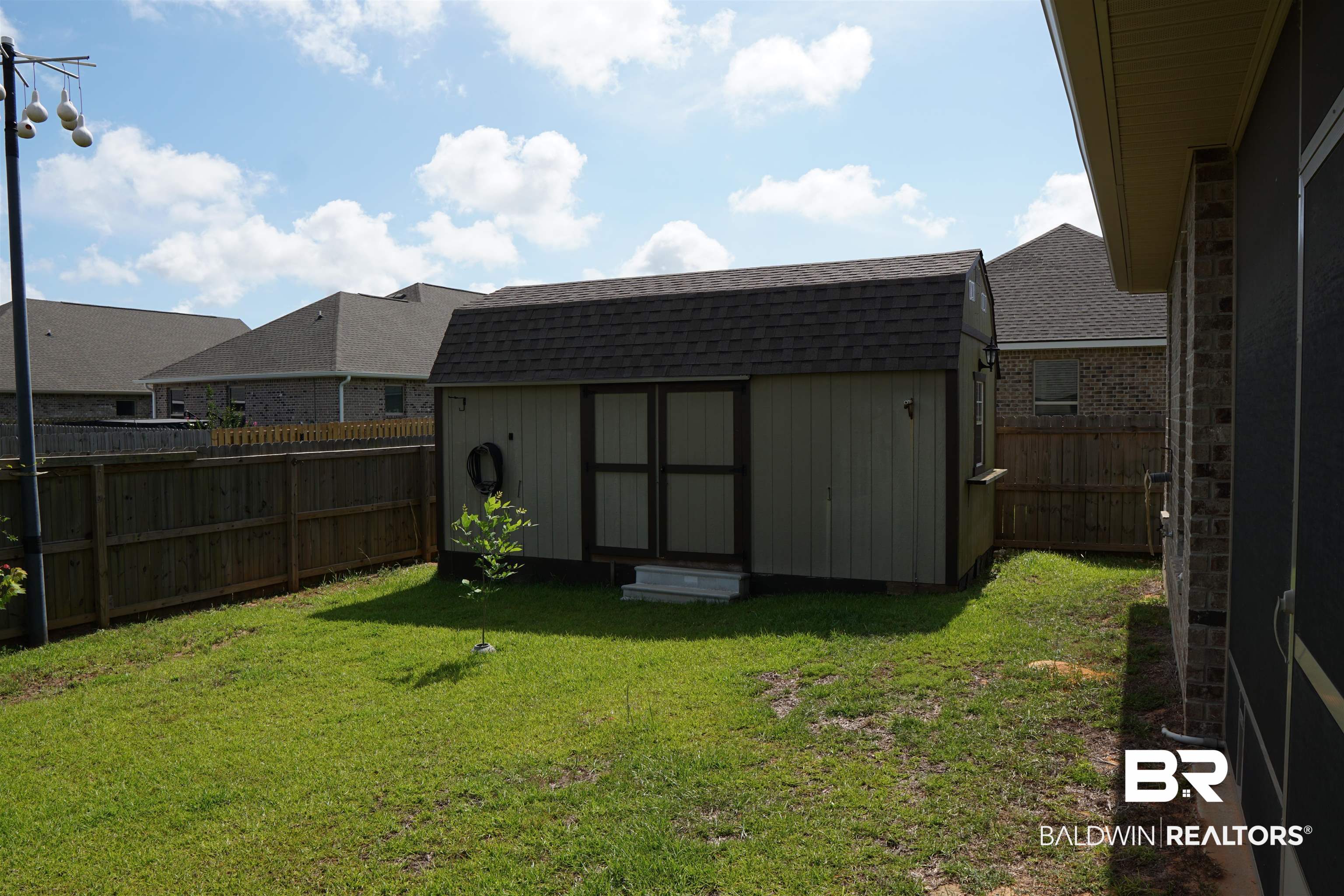 1060 Chloe Street Foley, AL 36535 - Photo 24 of 28 Detached storage shed featuring a shingled roof and a side window