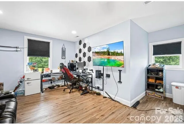 a workspace with furniture hardwood and a window