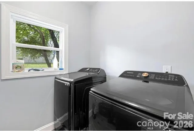 a view of storage and utility room with washer and dryer