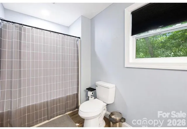 a bathroom with a toilet and a sink