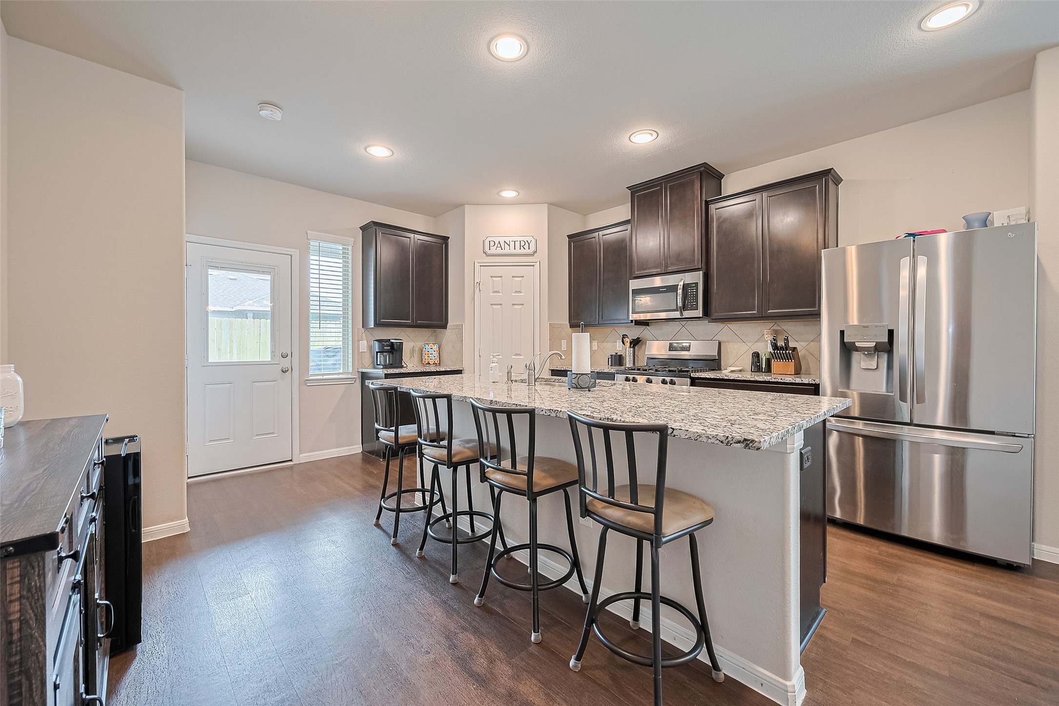 1214 Red Hills Drive Rosharon, TX 77583 - Photo 11 of 46 Functional kitchen with extra counter height sitting at the island