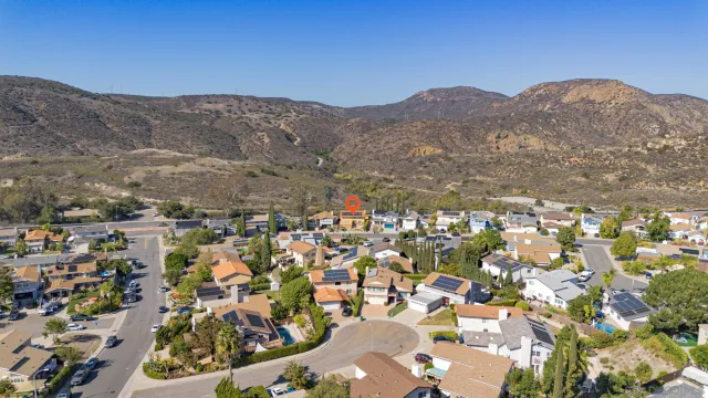 a view of multiple houses with a street