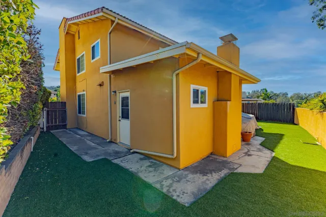 a view of a storage room with wooden shelves