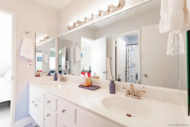 a bathroom with a shower and toilet