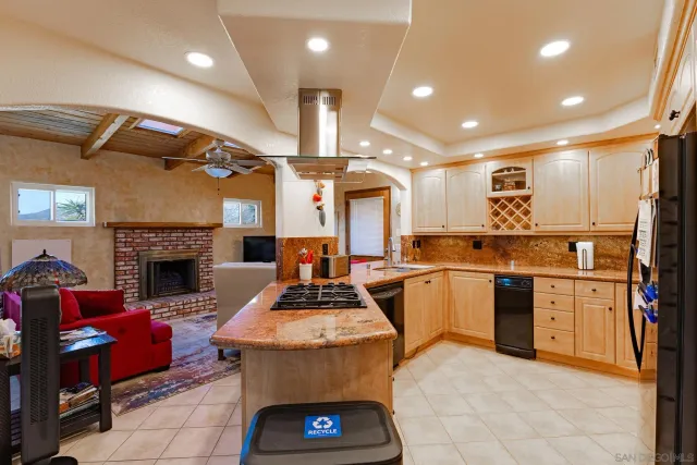 a kitchen with stainless steel appliances granite countertop a sink and cabinets