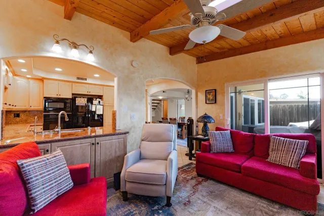 a living room with furniture and a rug