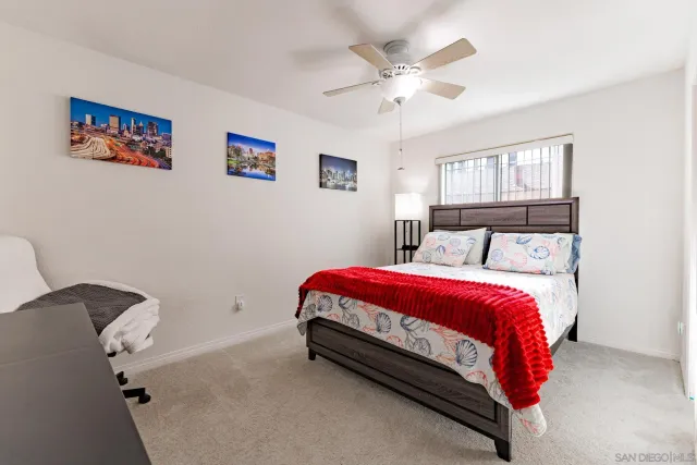 a bed room with a bed and a chandelier