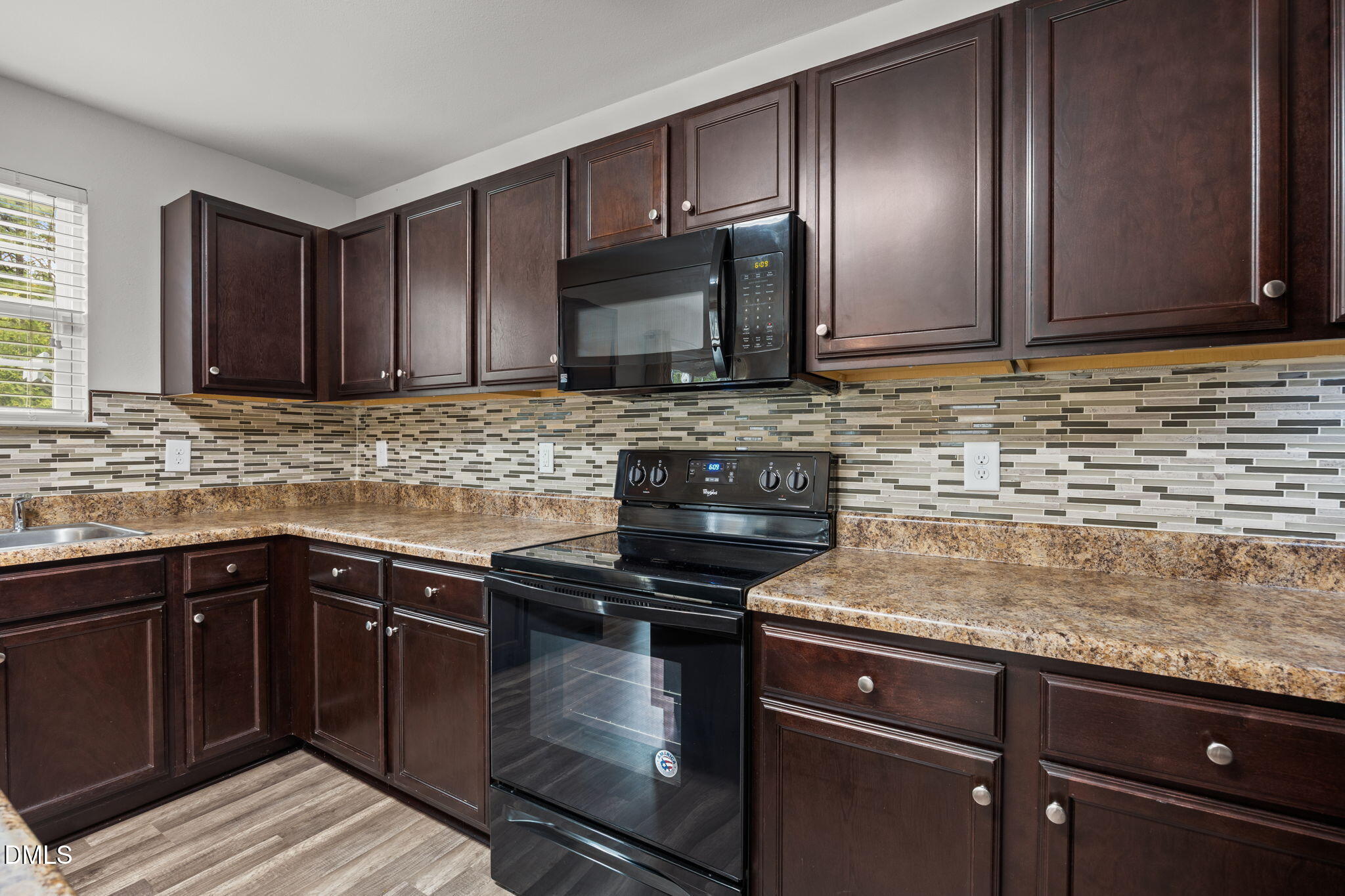 45 Crane Way Bunnlevel, NC 28323 - Photo 15 of 35 a kitchen with sink cabinets and stainless steel appliances