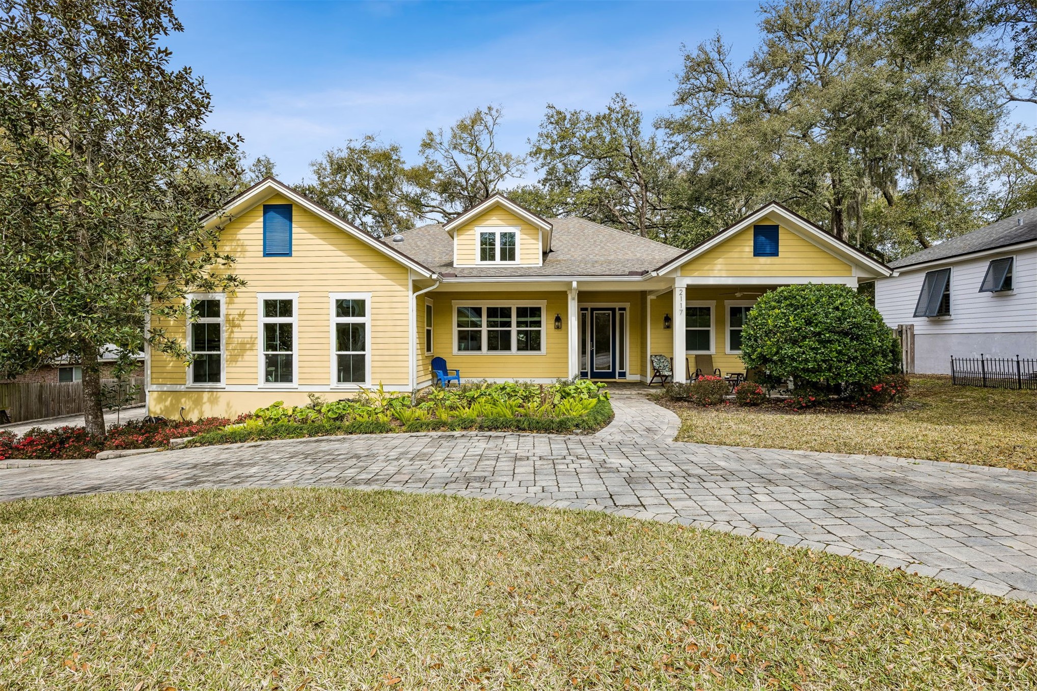 2117 Alachua Street Fernandina Beach, FL 32034 - Photo 2 of 52 a front view of a house with a garden