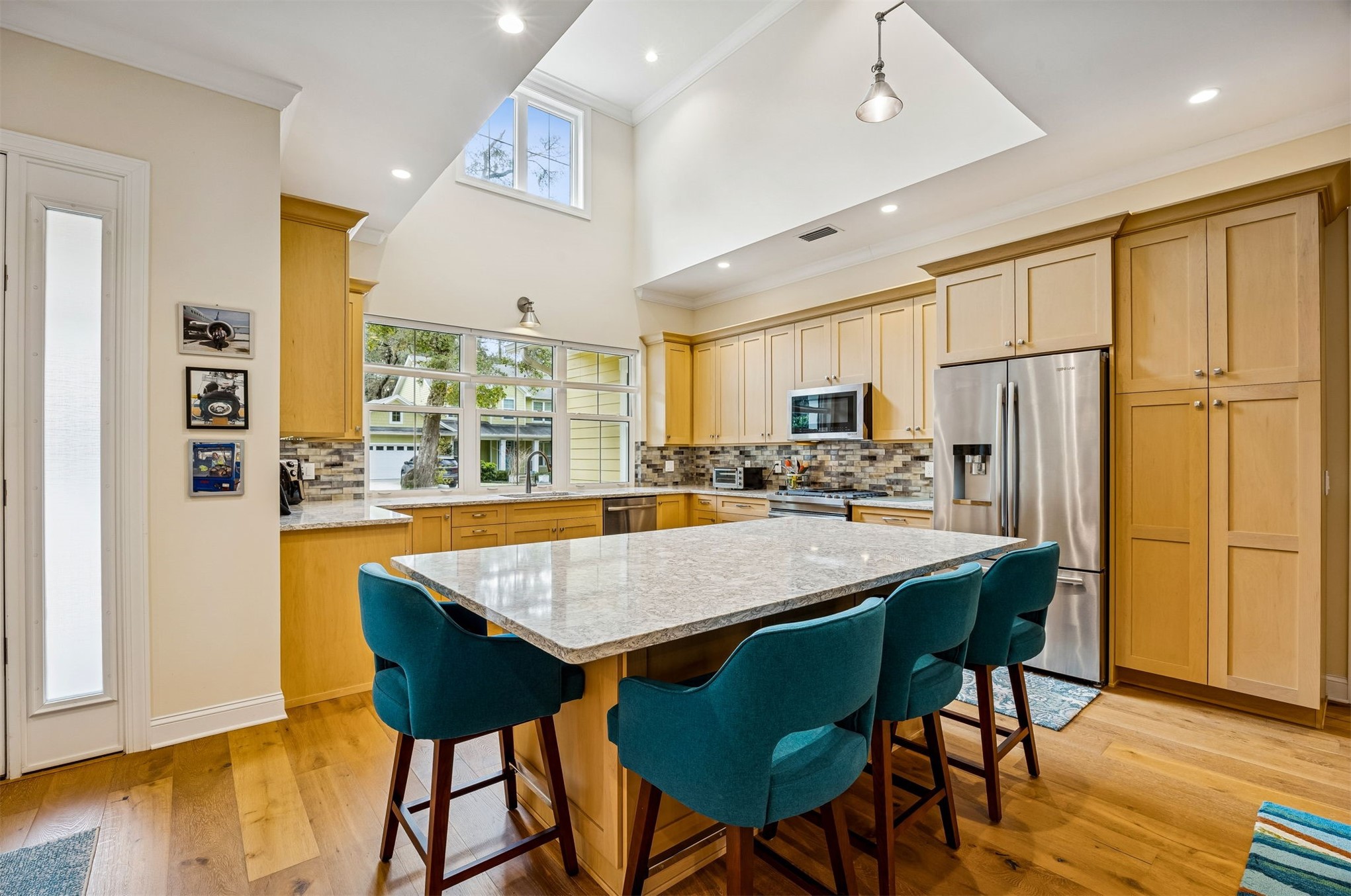 2117 Alachua Street Fernandina Beach, FL 32034 - Photo 23 of 52 a room with stainless steel appliances granite countertop a table chairs and a refrigerator
