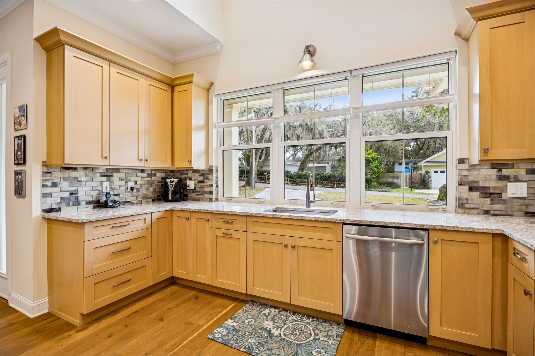 2117 Alachua Street Fernandina Beach, FL 32034 - Photo 24 of 52 a large kitchen with a window and cabinets