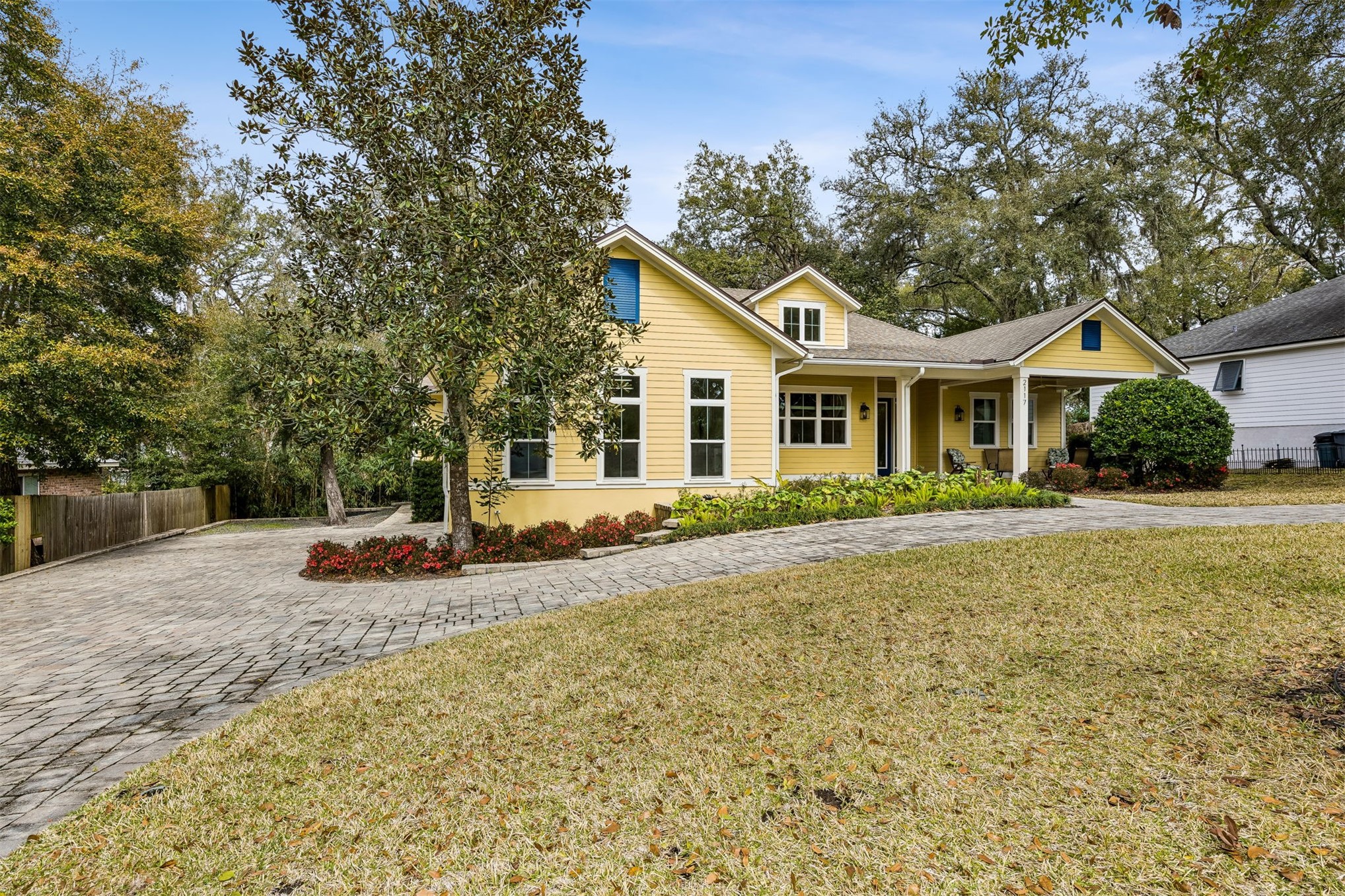 2117 Alachua Street Fernandina Beach, FL 32034 - Photo 3 of 52 a front view of a house with a yard and trees