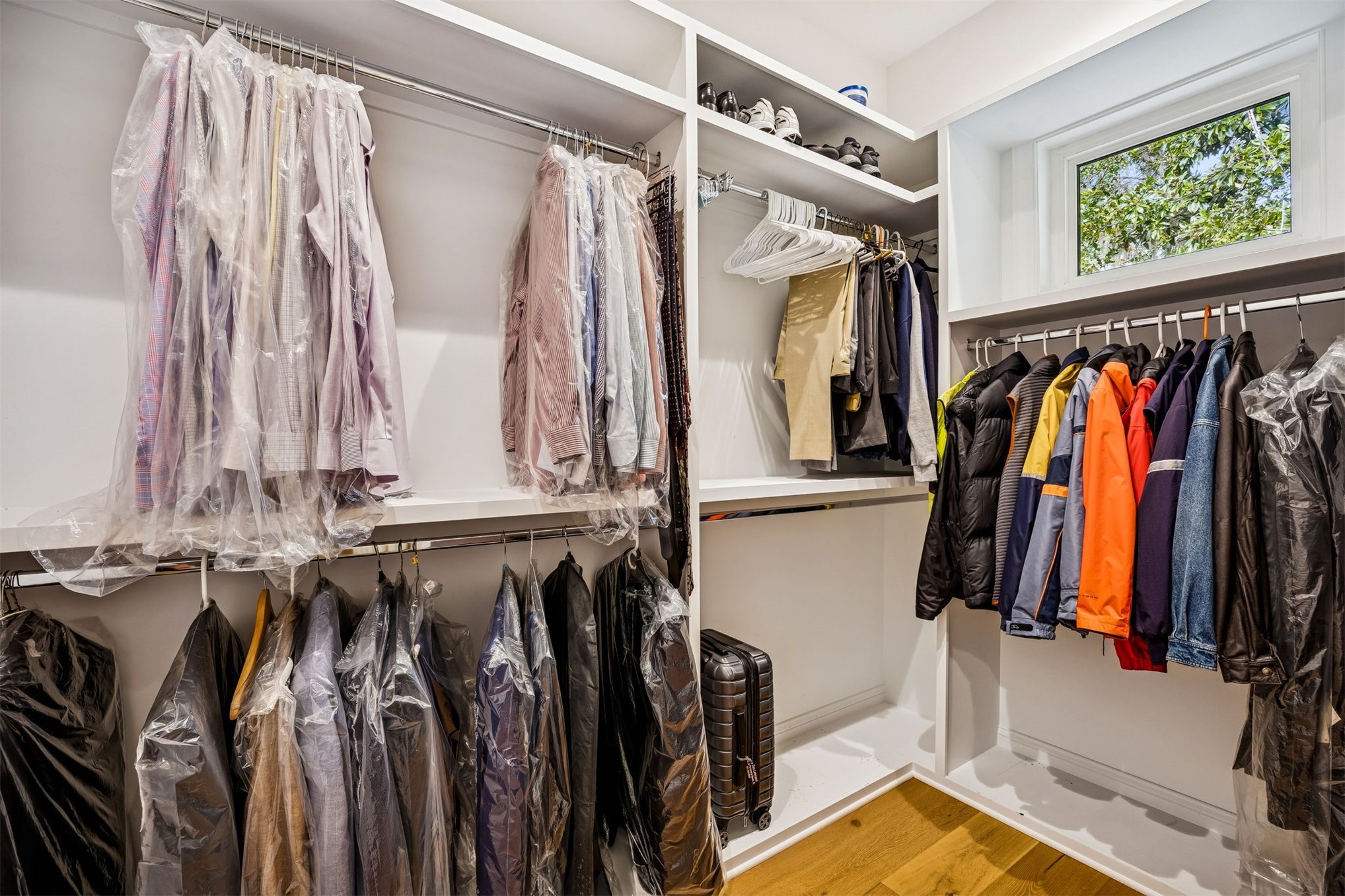 2117 Alachua Street Fernandina Beach, FL 32034 - Photo 32 of 52 a view of walk in closet with clothes and shoes