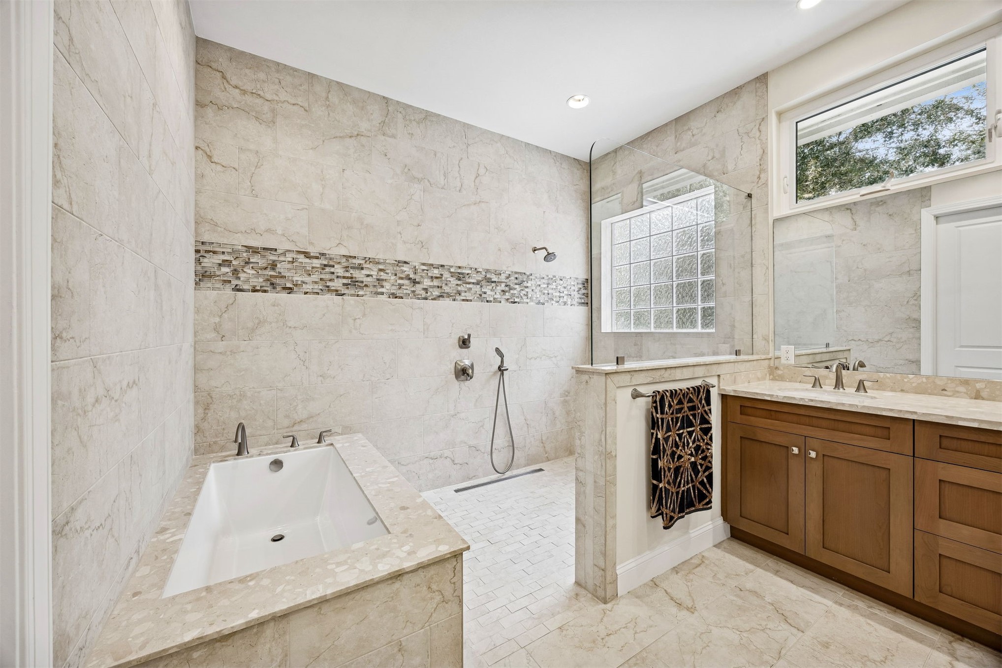 2117 Alachua Street Fernandina Beach, FL 32034 - Photo 35 of 52 a spacious bathroom with a tub sink and mirror