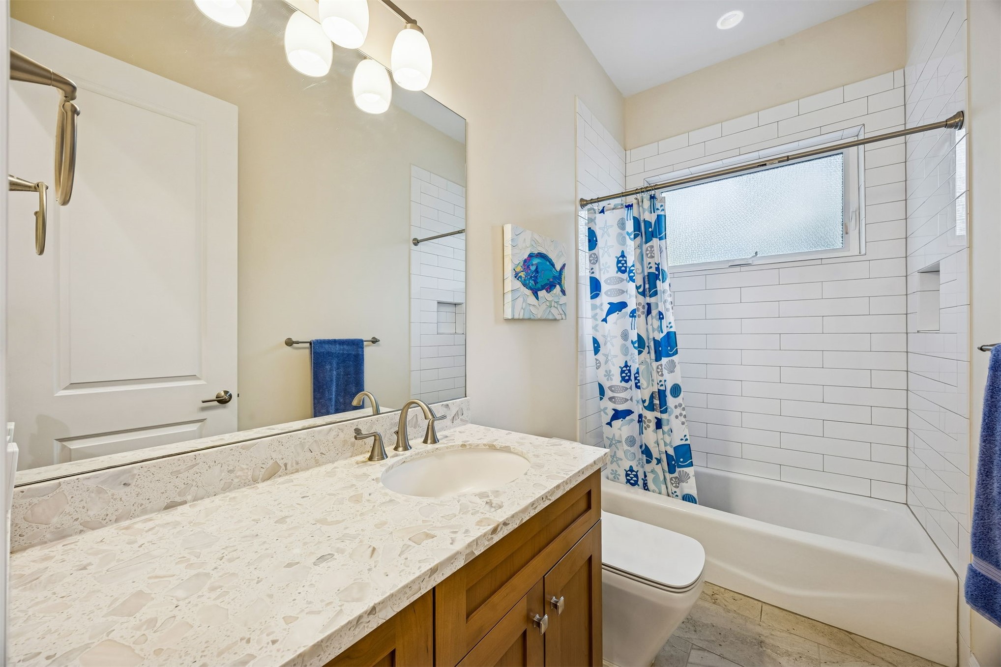 2117 Alachua Street Fernandina Beach, FL 32034 - Photo 40 of 52 a bathroom with a granite countertop sink toilet and shower