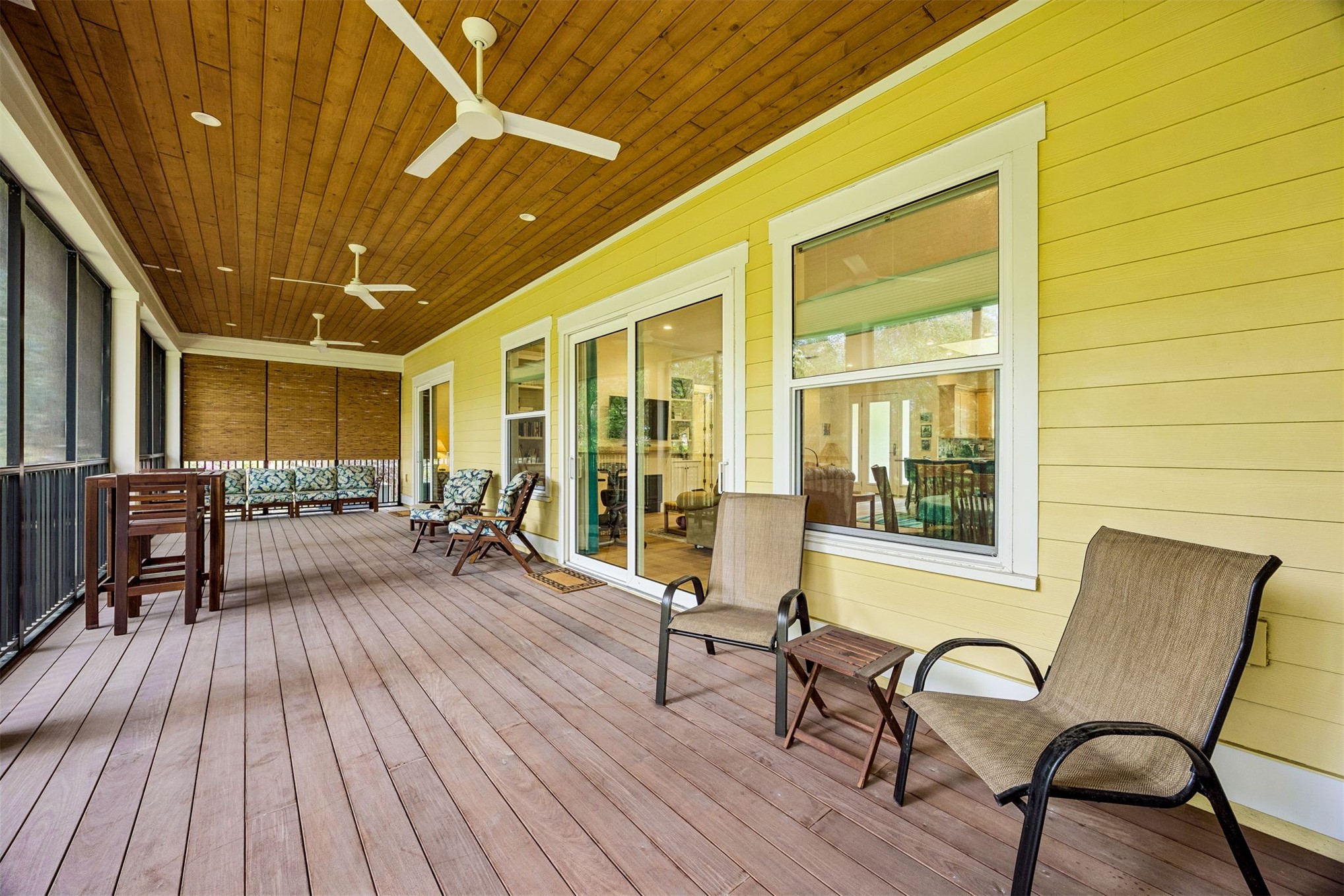 2117 Alachua Street Fernandina Beach, FL 32034 - Photo 46 of 52 a view of a patio with table and chairs and wooden floor