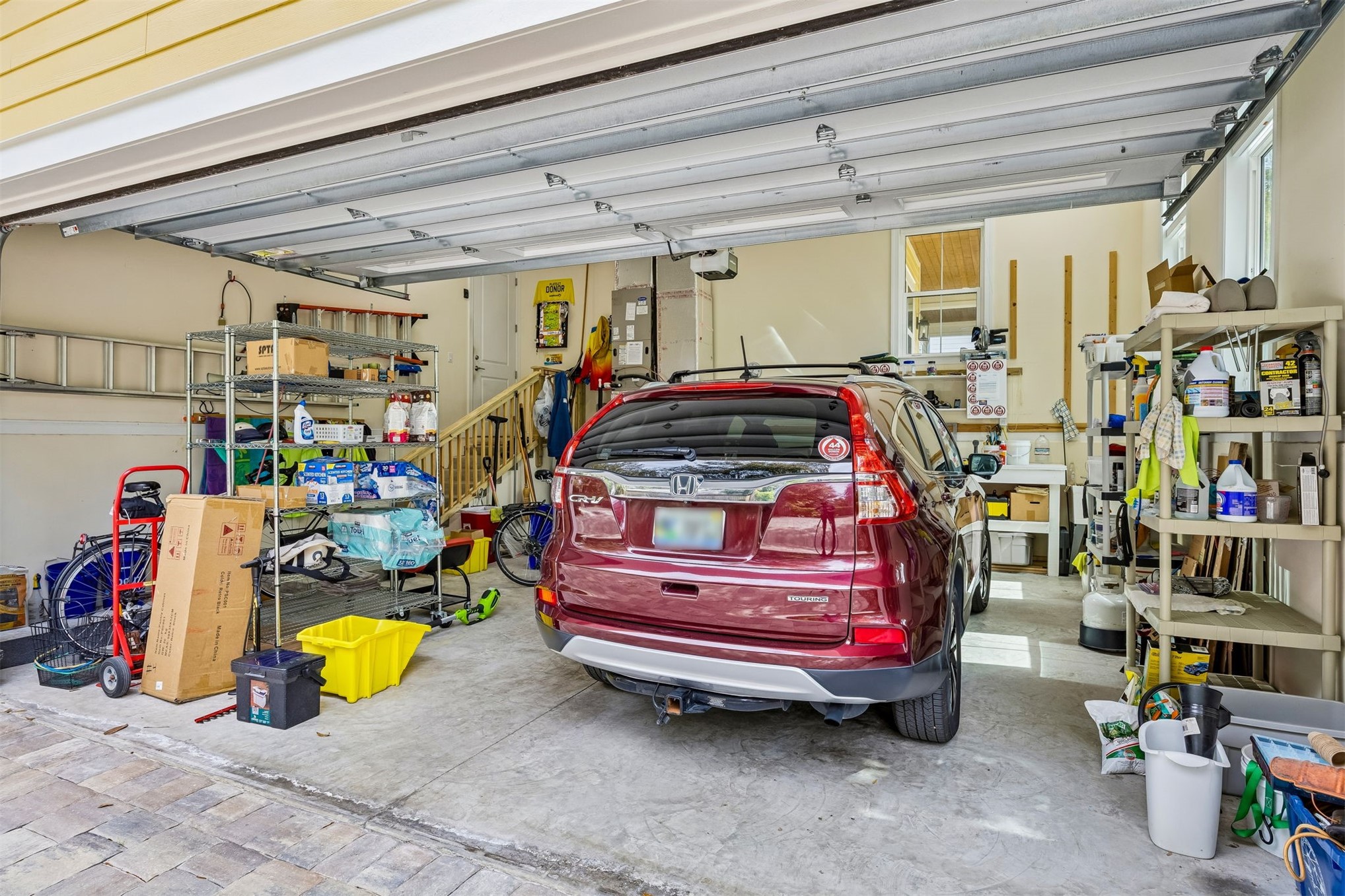 2117 Alachua Street Fernandina Beach, FL 32034 - Photo 49 of 52 a front view of a garage with stuff