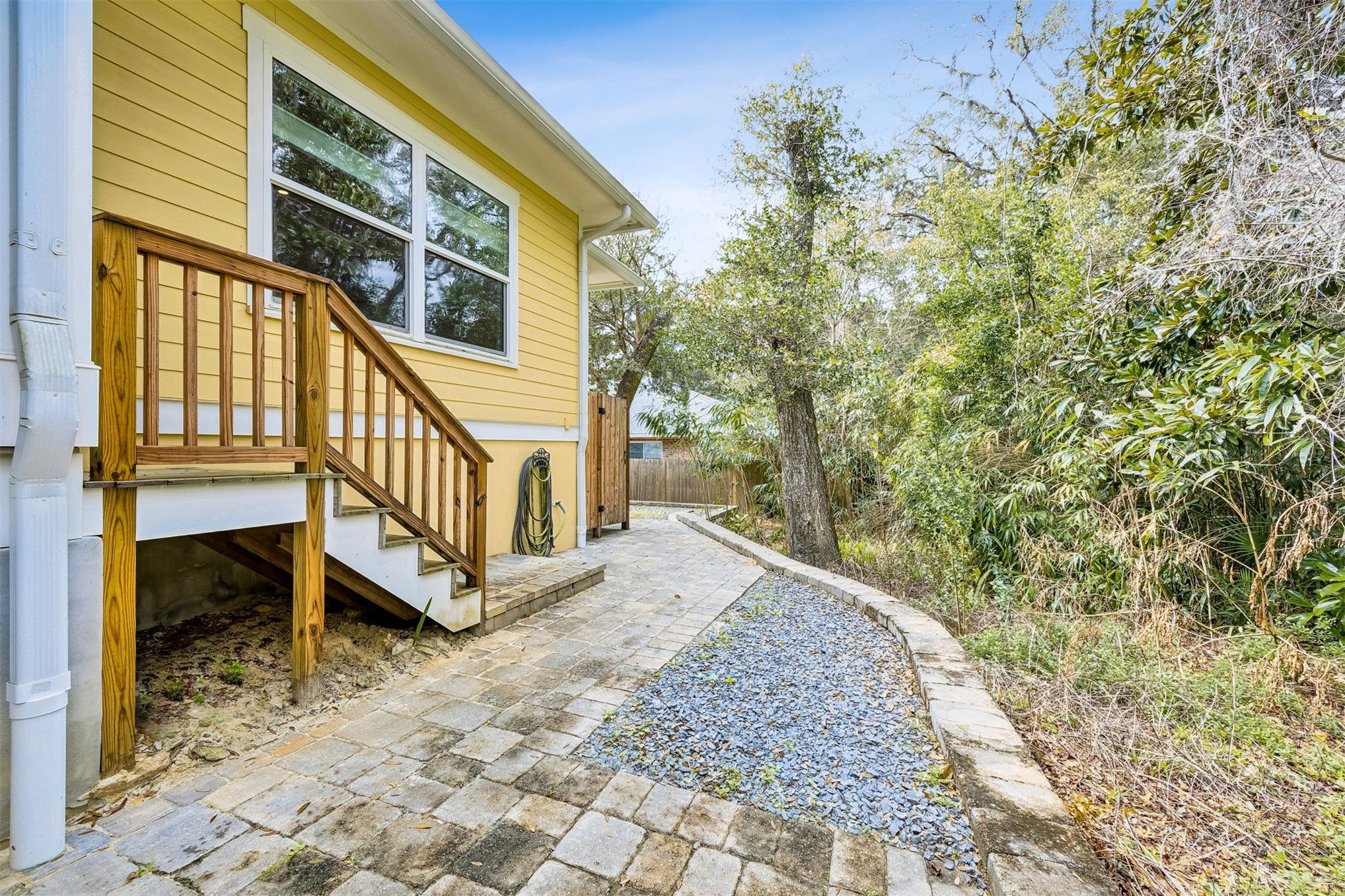2117 Alachua Street Fernandina Beach, FL 32034 - Photo 51 of 52 a view of a house with a small yard and wooden fence