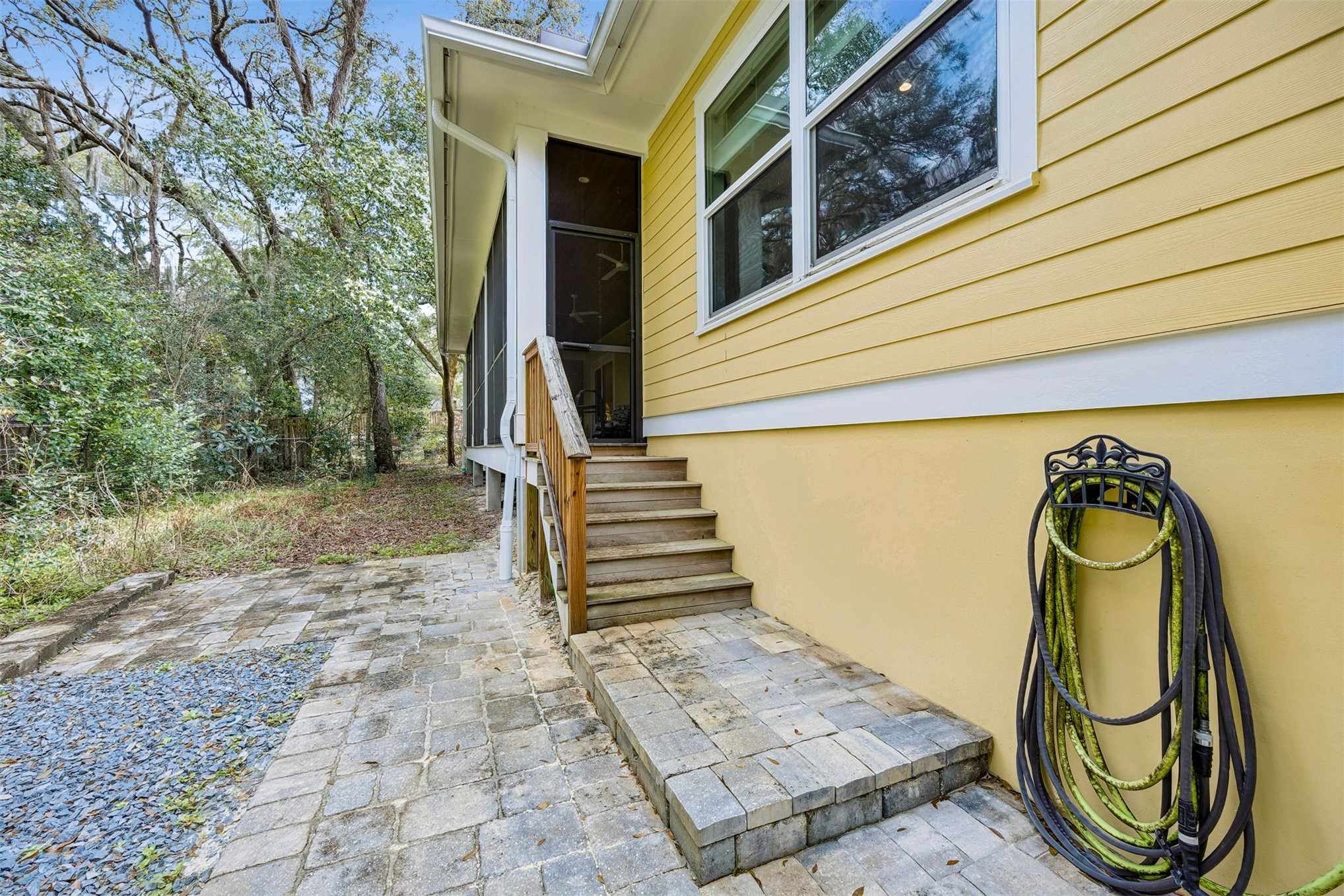 2117 Alachua Street Fernandina Beach, FL 32034 - Photo 52 of 52 a front view of a house with garden