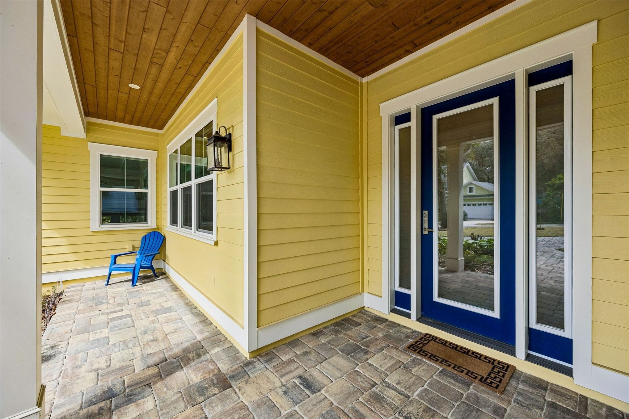2117 Alachua Street Fernandina Beach, FL 32034 - Photo 9 of 52 a view of a porch with a door and wooden floor