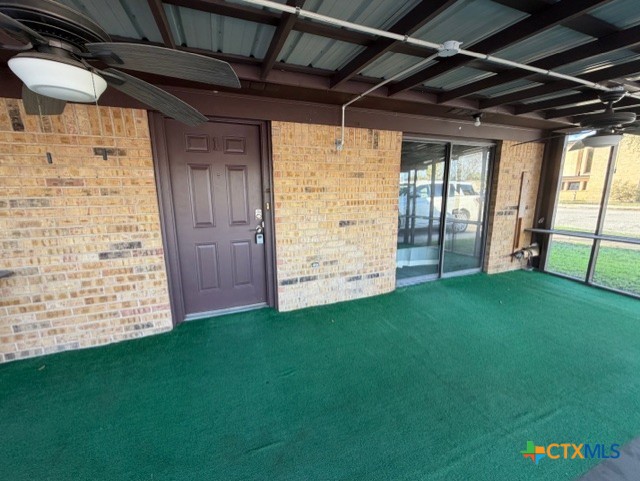 508 East Travis Street Luling, TX 78648 - Photo 14 of 17 a view of an empty room with windows