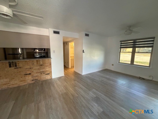 508 East Travis Street Luling, TX 78648 - Photo 2 of 17 a view of a livingroom with wooden floor