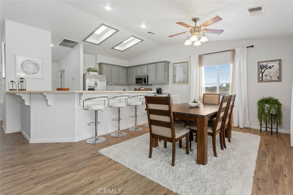 62382 Crestview Drive Joshua Tree, CA 92252 - Photo 11 of 31 a view of a dining room with furniture and wooden floor