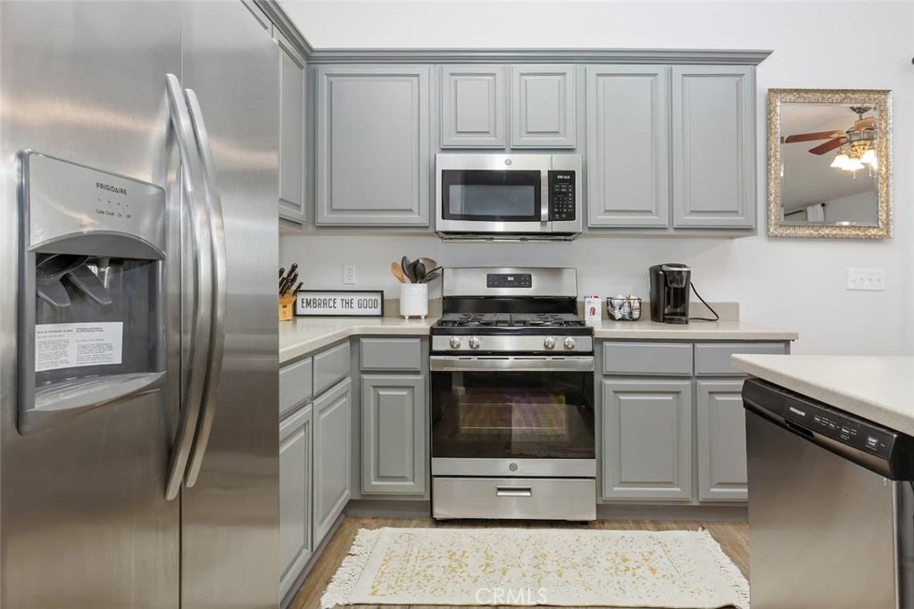 62382 Crestview Drive Joshua Tree, CA 92252 - Photo 13 of 31 a kitchen with white cabinets stainless steel appliances and a sink