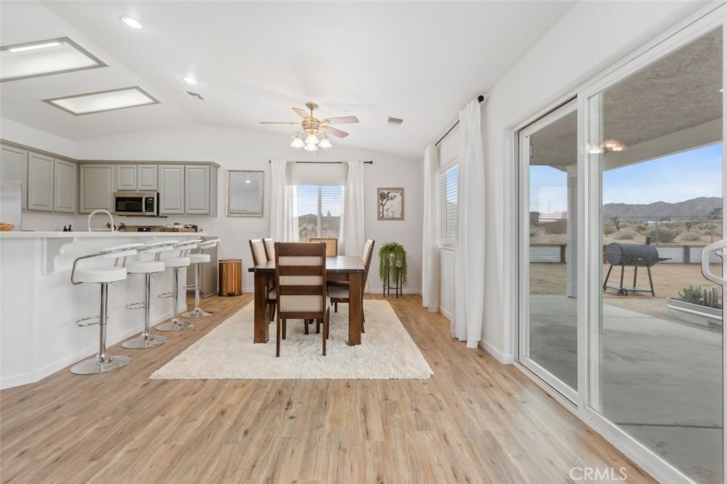 62382 Crestview Drive Joshua Tree, CA 92252 - Photo 16 of 31 a view of a dining room with furniture and wooden floor