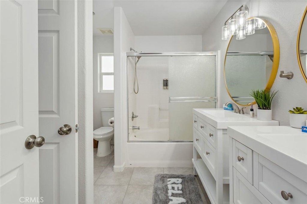 62382 Crestview Drive Joshua Tree, CA 92252 - Photo 20 of 31 a bathroom with a double vanity sink mirror and shower