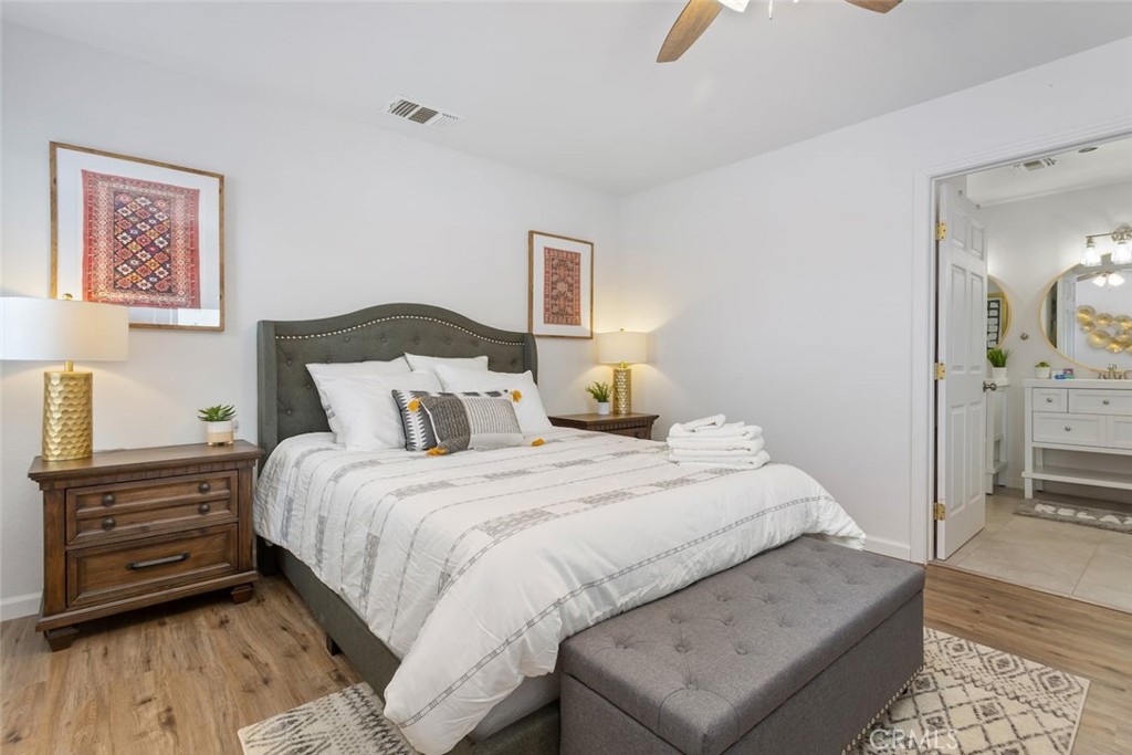 62382 Crestview Drive Joshua Tree, CA 92252 - Photo 21 of 31 a bedroom with bed and wooden floor