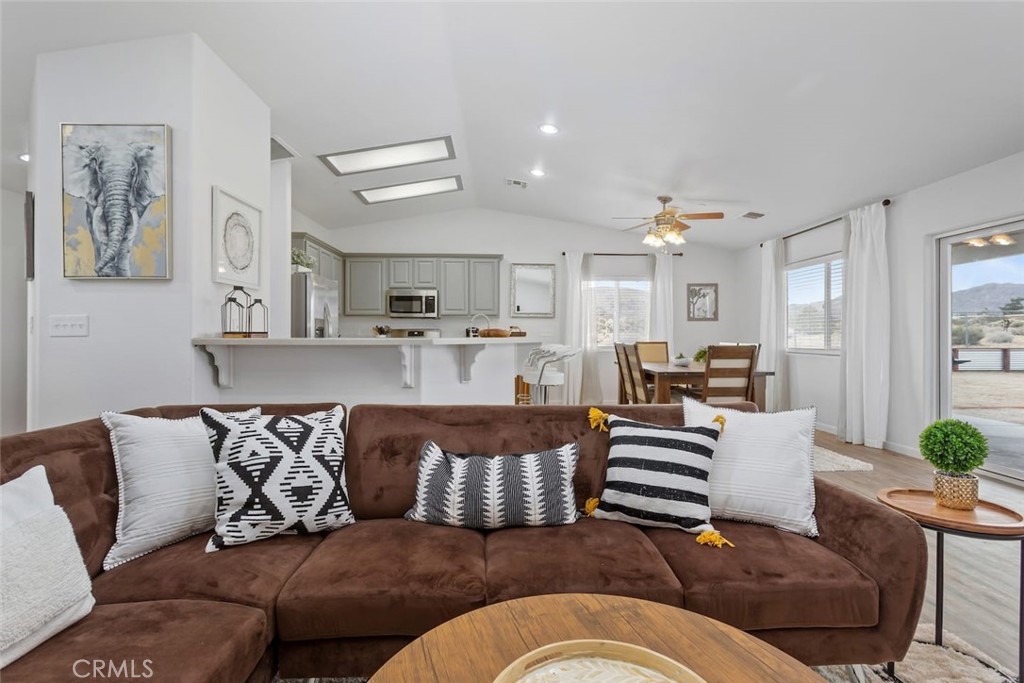 62382 Crestview Drive Joshua Tree, CA 92252 - Photo 9 of 31 a living room with a couch and chandelier